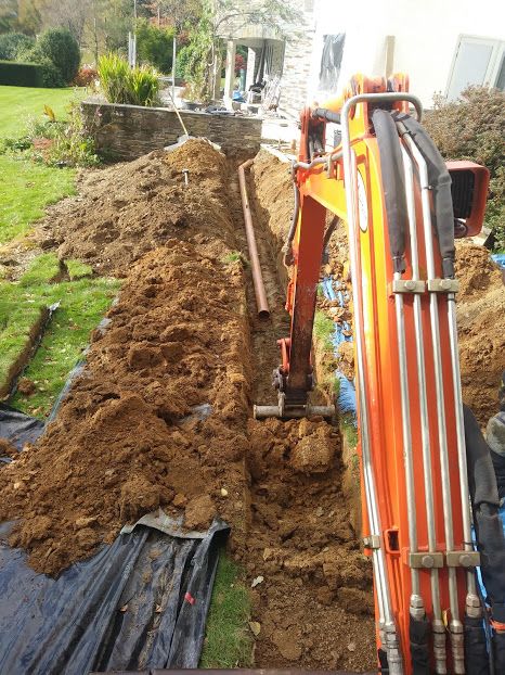 Drainage Specialists, Excavator digging new drainage Install